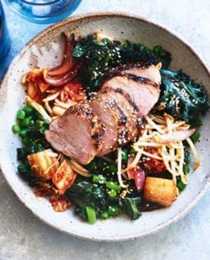 Roasted pork with warm kimchi and kale salad