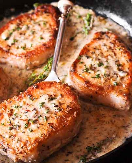 Boneless Pork Chops in Creamy Garlic and Herb Wine Sauce