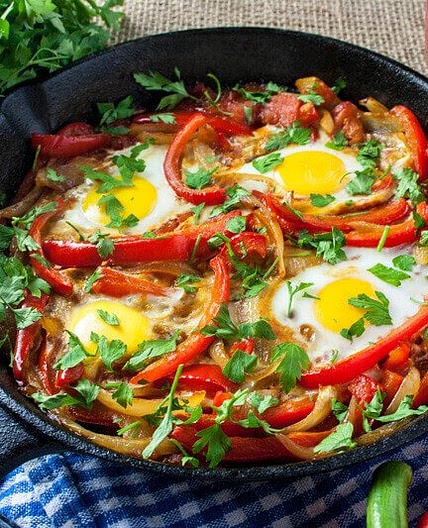 Baked Eggs Skillet With Red Peppers And Onions