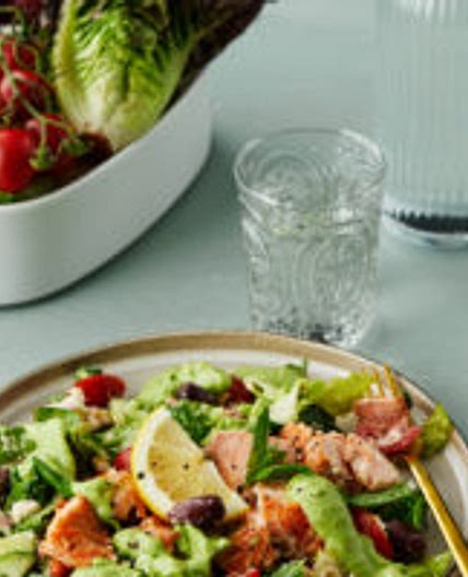 Salmon salad with feta cheese and avocado dressing