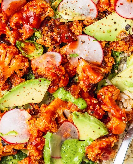 Spicy Buffalo Cauliflower Bowls with Avocado and Green Tahini