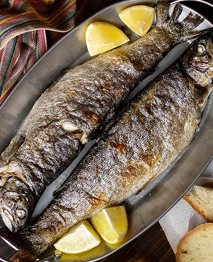 Simple broiled rainbow trout with dandelion greens