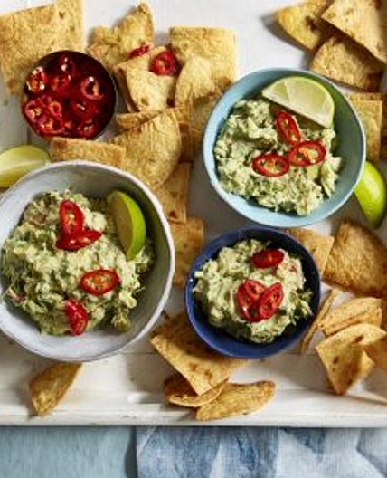Homemade tortilla chips with tequila guacamole