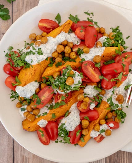 Mediterranean sweet potato and chickpea salad with garlic-tahini dressing