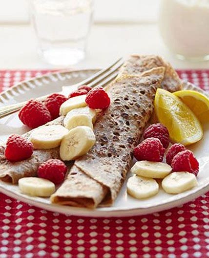 Cinnamon crêpes with nut butter, sliced banana & raspberries