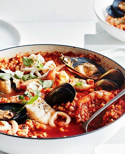 Seafood and tomato fregola