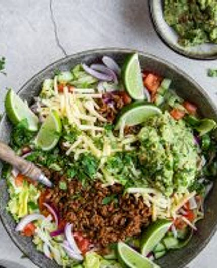 Keto taco salad with salsa dressing and guacamole