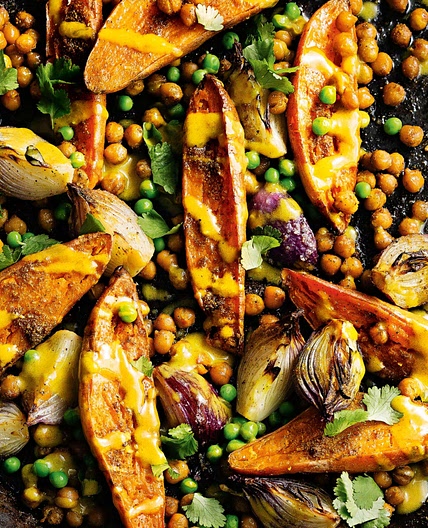 Spicy sweet potato and chickpea bake with lime tahini dressing