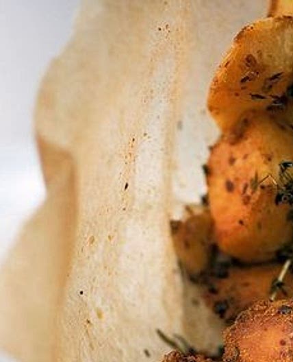 Crack potatoes courtesy of Ottolenghi. Harissa and confit garlic roast potatoes