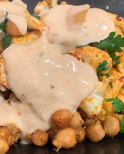 Roast cauliflower and chickpeas with a tahini dressing 