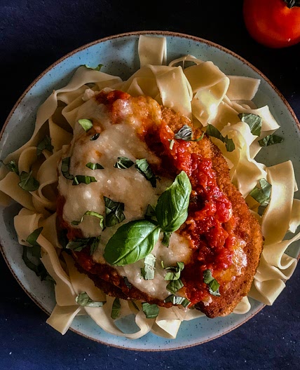 Chicken parmigiana served on tagliatelle 