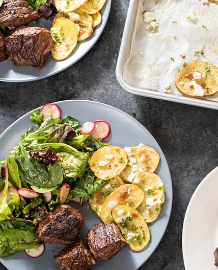 Skillet Steak Tips with Roasted Feta Potatoes and Mesclun Salad