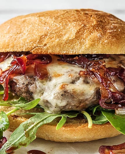 Melty Mozzarella Burgers with Caramelized Onion and Balsamic Greens on Ciabatta