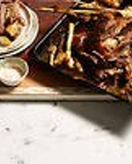 Slow-cooked lamb shoulder, pearl onions, young garlic and rosemary
