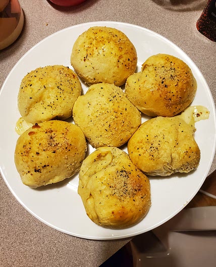 STUFFED GARLIC KNOTS /W HONEY BUTTER GLAZE.