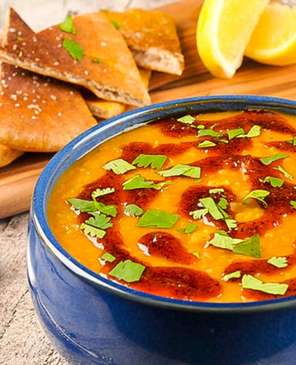Red Lentil Soup with berbere oil, lemon, cilantro, and whole wheat pita