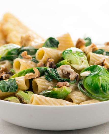 Roasted Garlic Cream Rigatoni with Brussels Sprouts with walnuts and garlic bread