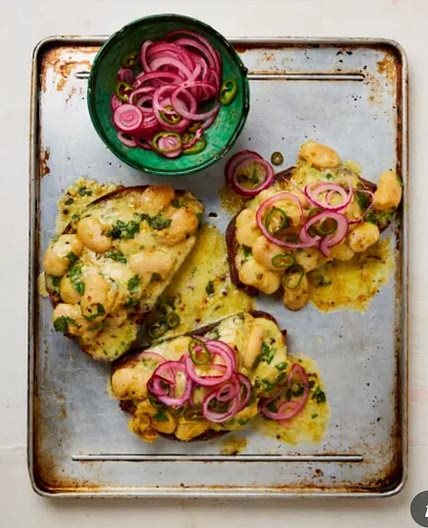 Cheesy curried butter beans on toast