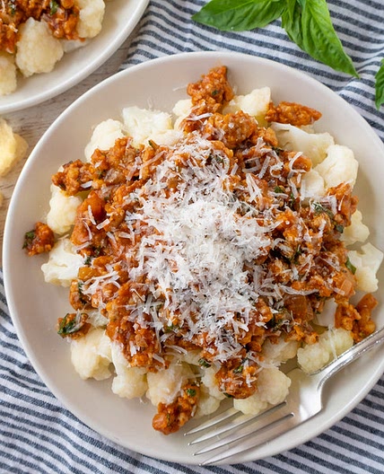 Sausage-Basil Ragú over Tender Cauliflower with Parmesan