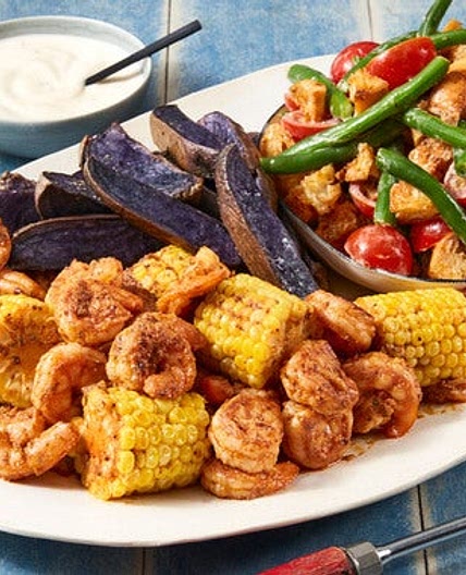 Garlic-Butter Shrimp & Corn with Green Bean Salad & Roasted Purple Potatoes