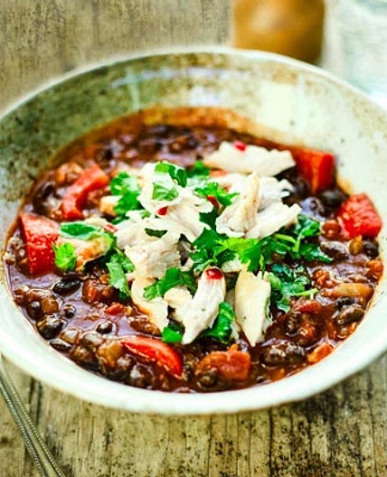 Mexican Bean soup with shredded chicken and lime
