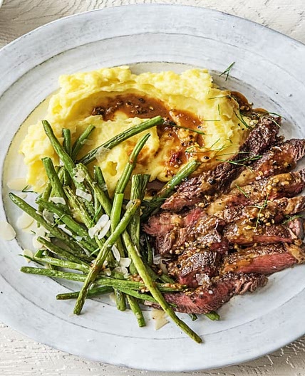 Peppered Rib-Eye Steak with Truffled Mashed Potatoes and Green Beans Amandine