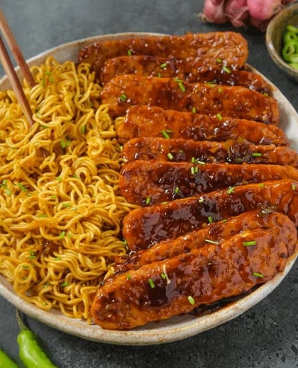 Sweet and Spicy Tempeh with Garlic Curry Noodles - The Foodie Takes Flight