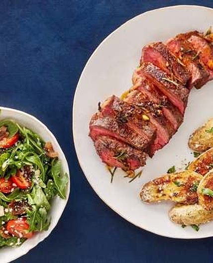 Pan-Seared Strip Steaks & Rosemary-Butter Sauce with Arugula Salad & Garlic-Parmesan Potatoes