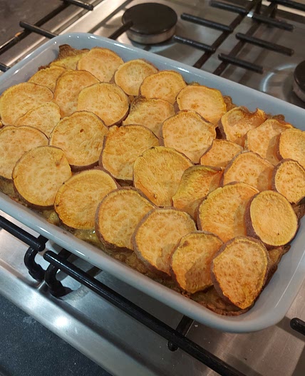 Sweet potato, dahl and spinach gratin