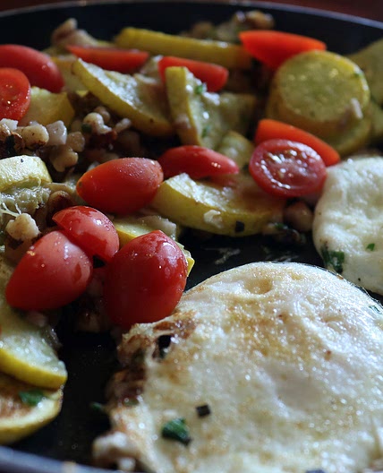 Fried eggs with sautéed yellow squash and walnuts