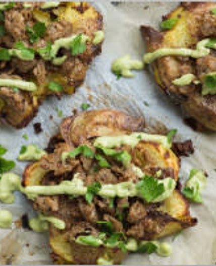 Smashed potatoes with avocado aioli and sausage