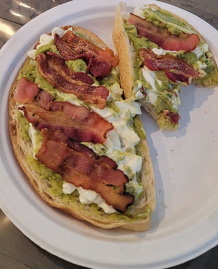 Sourdough toast with egg, guac, & bacon
