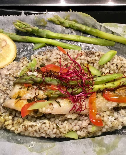 Colin fillet on a bed of barley, chia and asparagus, in foil