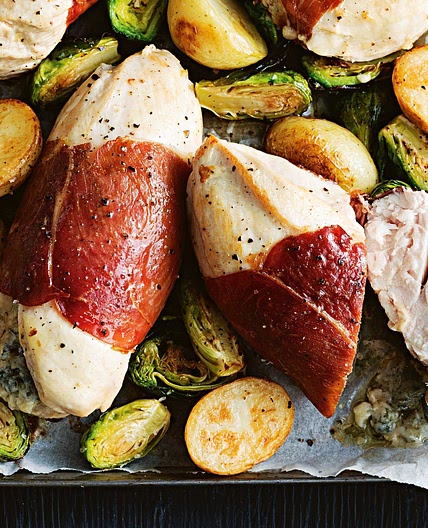 Stuffed chicken with roast sprouts and spuds