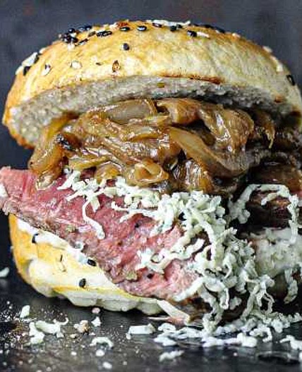 Steak bagel with miso butter onions, blue cheese and roasted garlic mayo