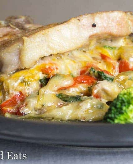 Cheesy Spinach Stuffed Pork Chops with Peppers & Onions