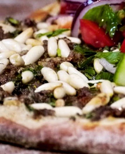 Lahmacun - Turkish pizza with spicy minced beef and salad topping
