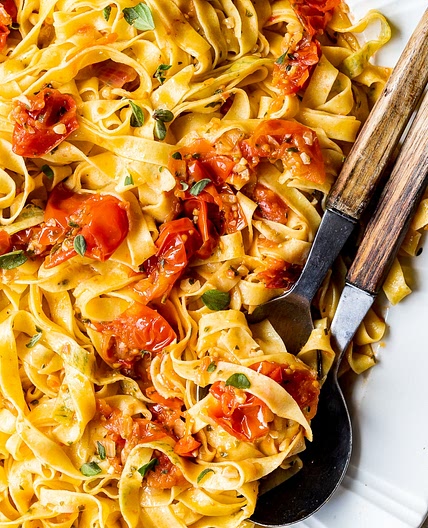Herb-laminated tagliatelle with cherry tomato sauce