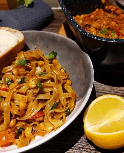 Fried Tagliatelle with Chickpeas and Tomatoes in Cajun Oil