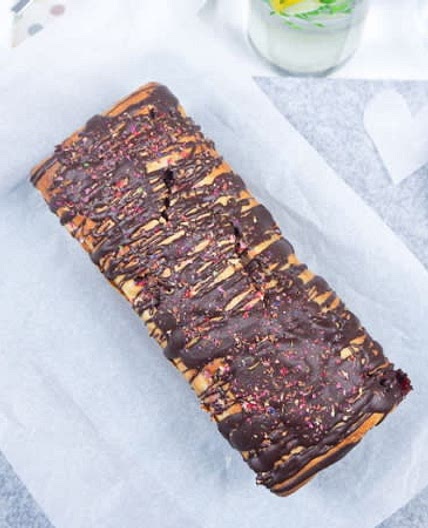 Banana Bread with strawberries and chocolate glaze