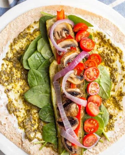 Roasted veggie wrap with pesto and goat cheese