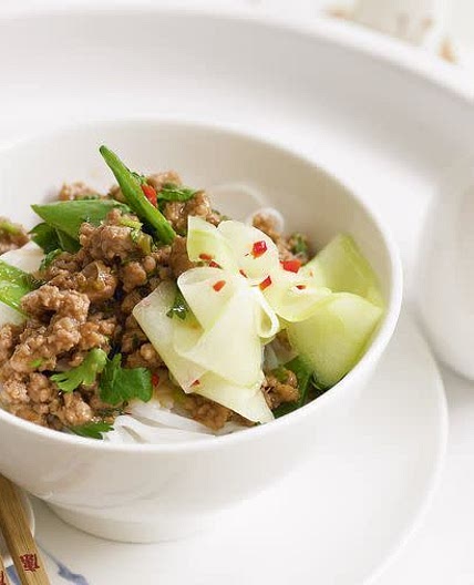 Stir-fried pork and pickled cucumber on rice noodles