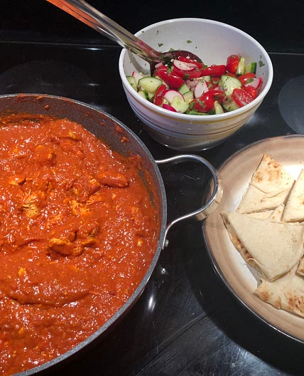 Butter Chicken with Rice and Naan served with Cucumber Salad