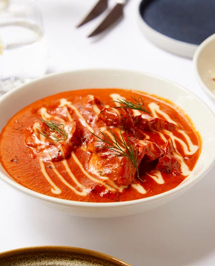 Butter Chicken served with saffron Pulao by Delhi 'O' Delhi