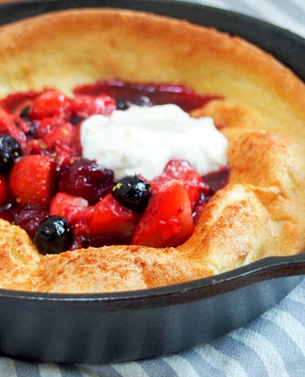 Individual Dutch baby pancake with berries and maple yogurt