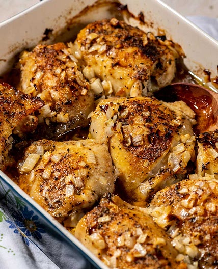 Baked chicken thighs with butter and onions are an ode to a childhood spent cooking with Mom