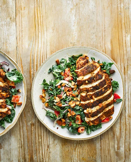 Cumin-crusted chicken with kale salad and hummus dressing