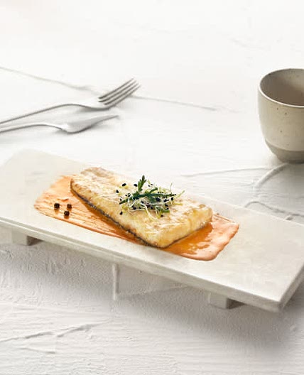Merluza europea confitada con escabeche de calabaza