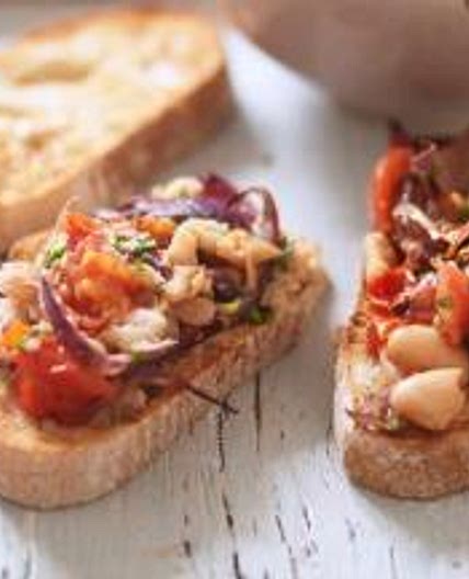 Bruschetta with roast tomato red onion and cannellini beans