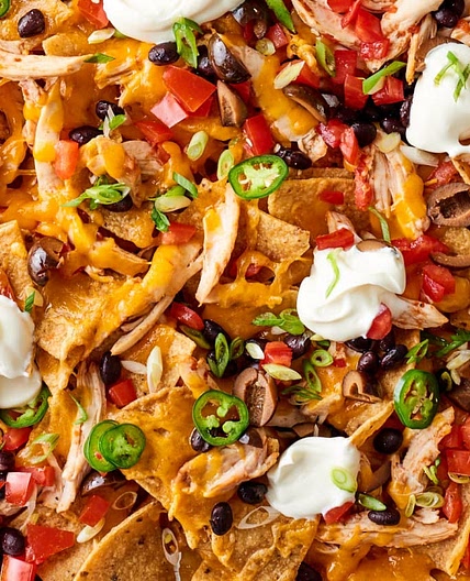 These Easy Sheet Pan Chicken Nachos Will Make You a Dinner Hero